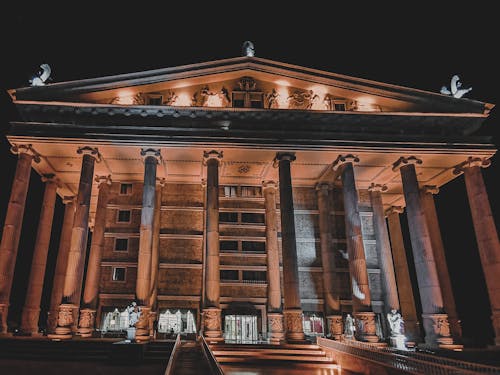 Ancient Building with Bedrocks in Lights at Night