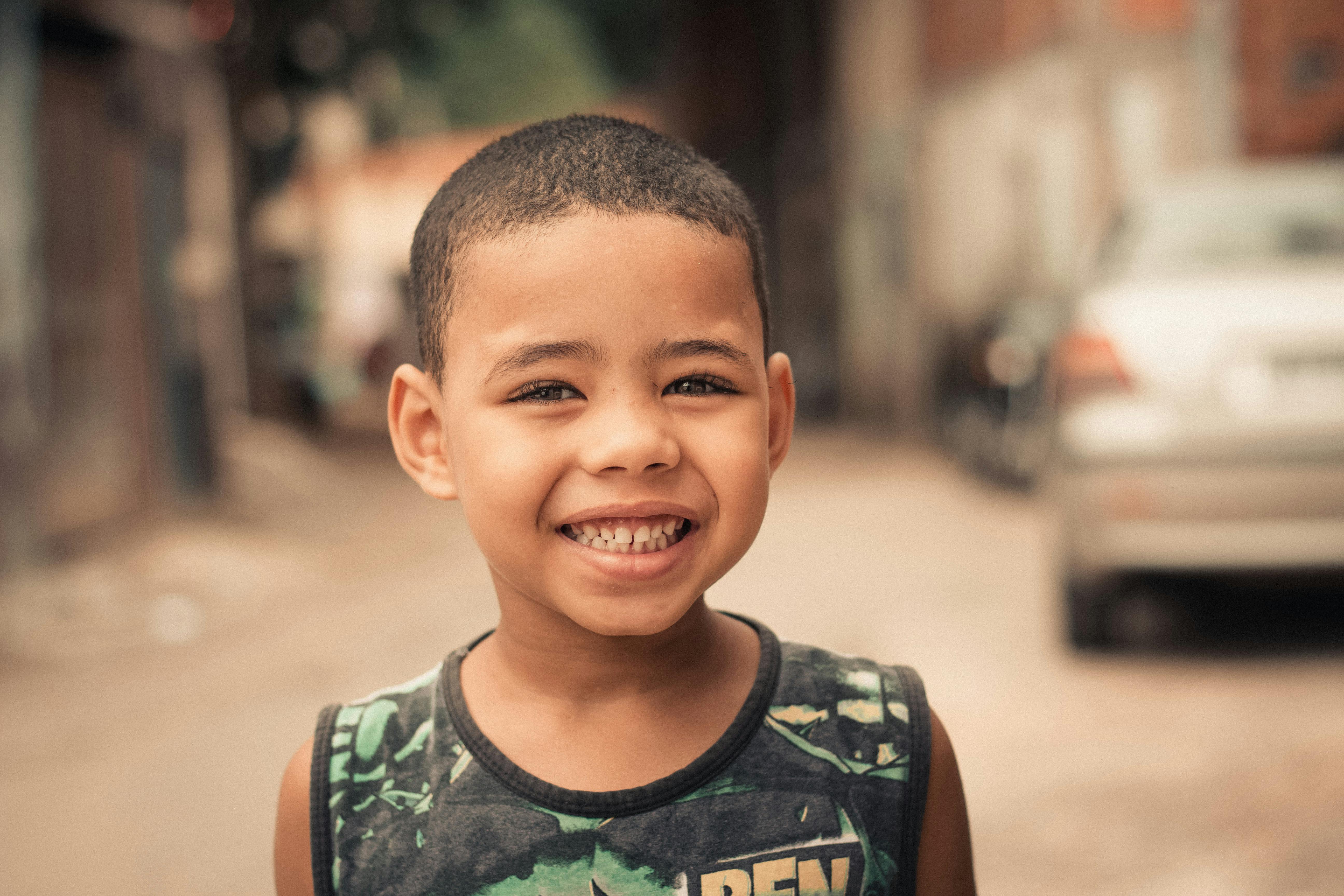 cheerful ethnic boy looking at camera