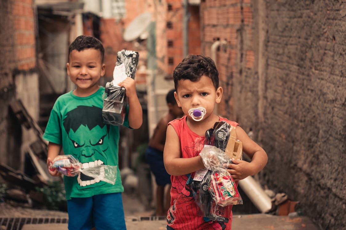 Adorable little boys with new toys