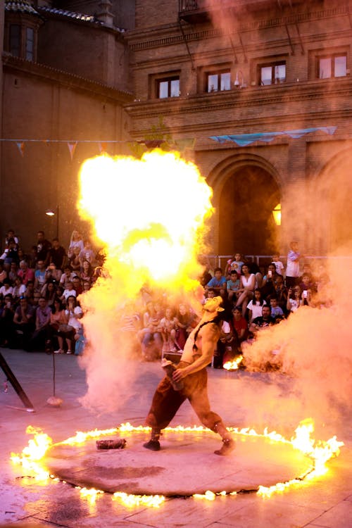 Man Spitting Fire in Front of an Audience