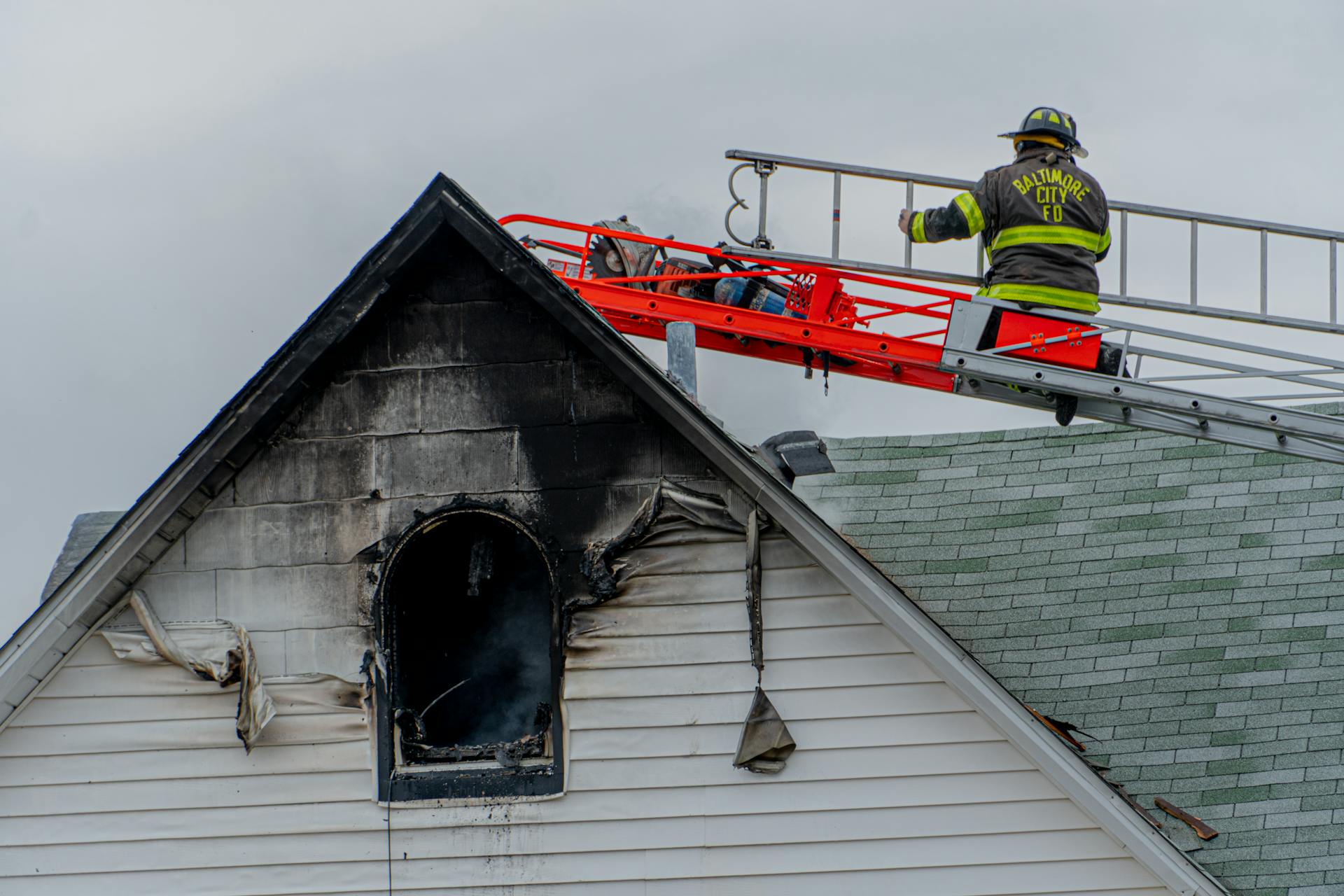 Firefighter on Building Roof