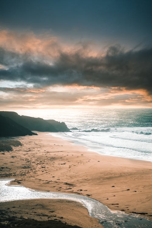 Foto profissional grátis de à beira-mar, água, alvorecer