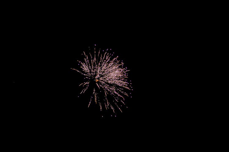 Glowing Firework In Dark Sky