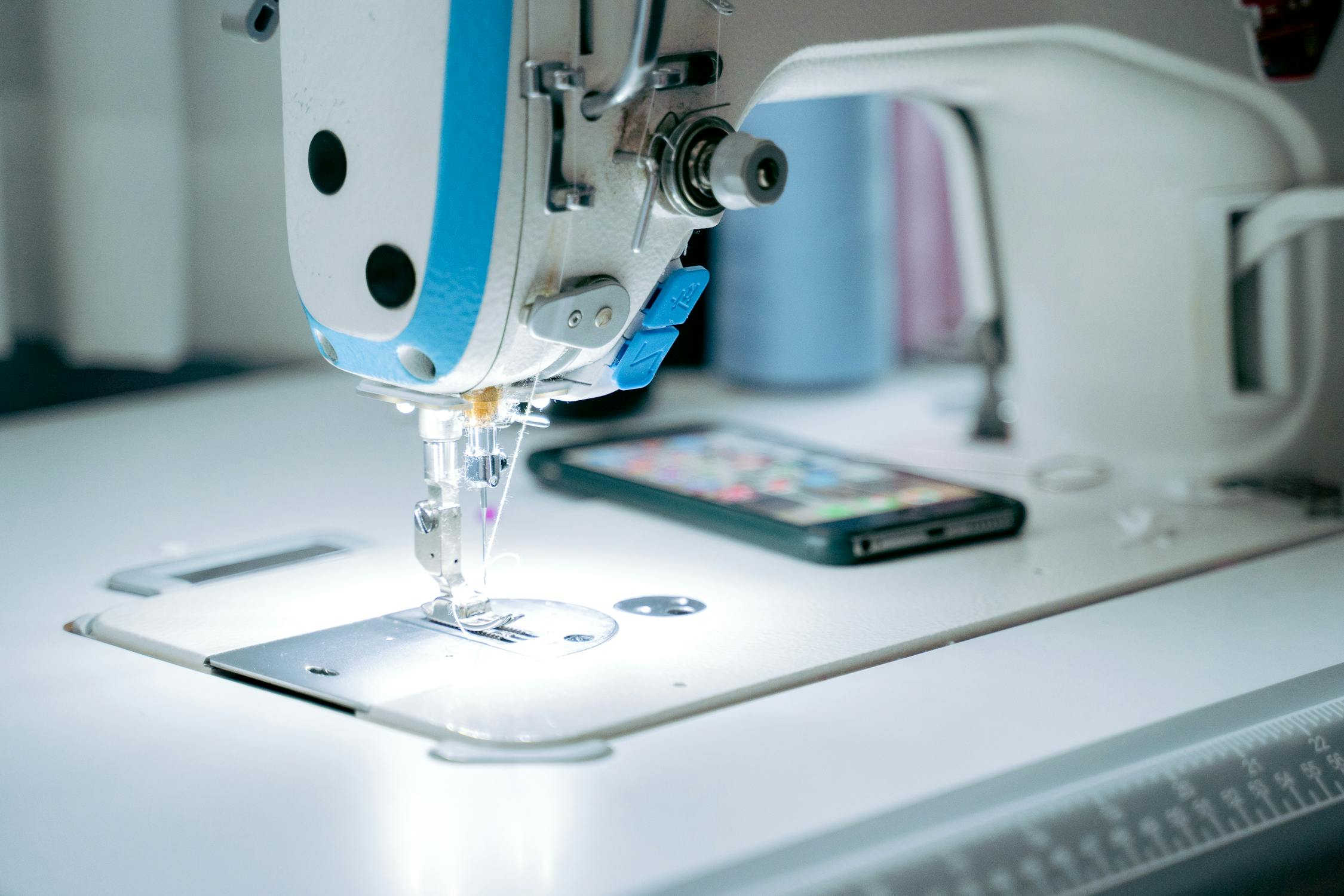 A Close-Up Shot of a Sewing Machine · Free Stock Photo