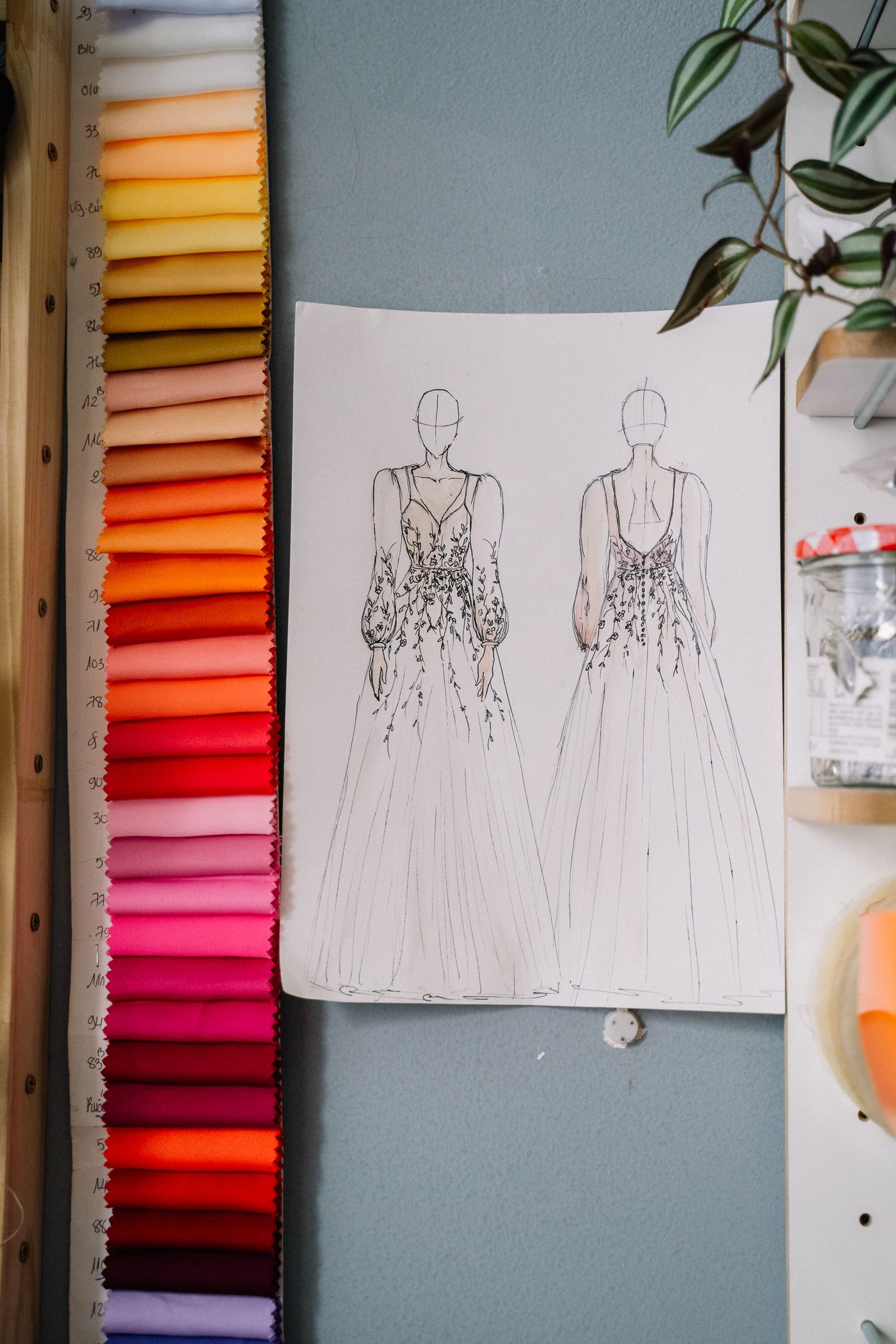 Dress design sketch with colourful fabric samples