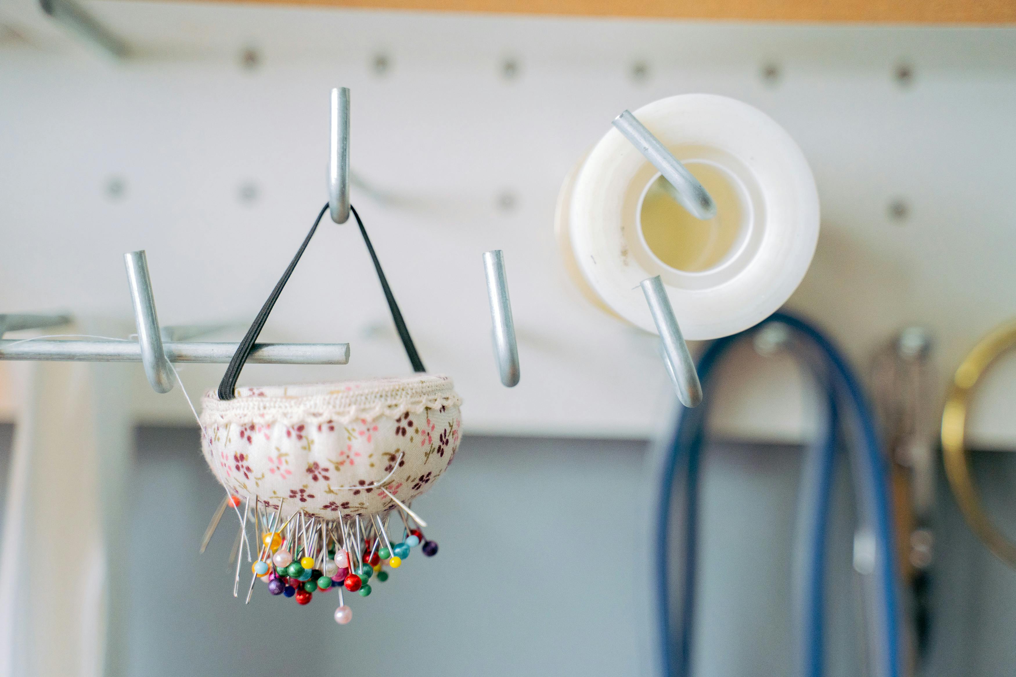 close up photo of a pincushion hanging