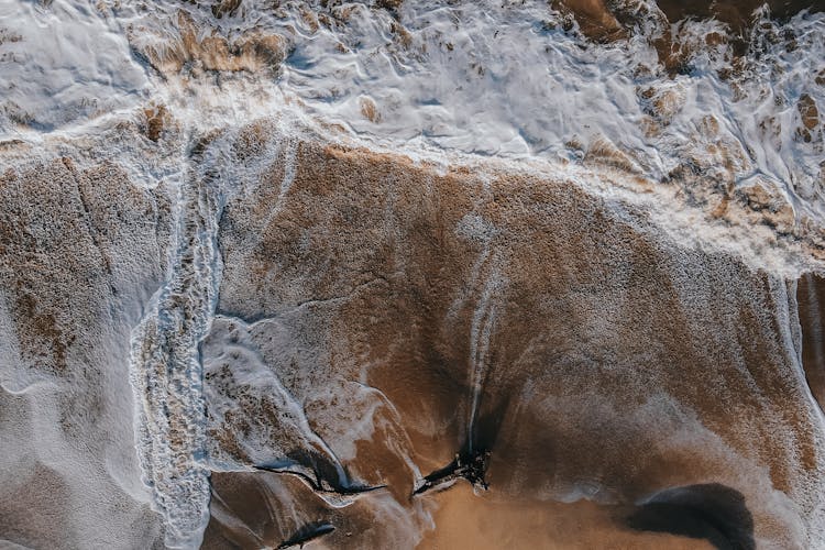 Sea Water Washing Sandy Beach