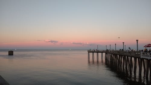 免費 日落期間海上棕色木碼頭 圖庫相片