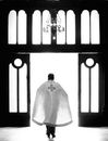 Man in White Dress Shirt Standing in Front of Window