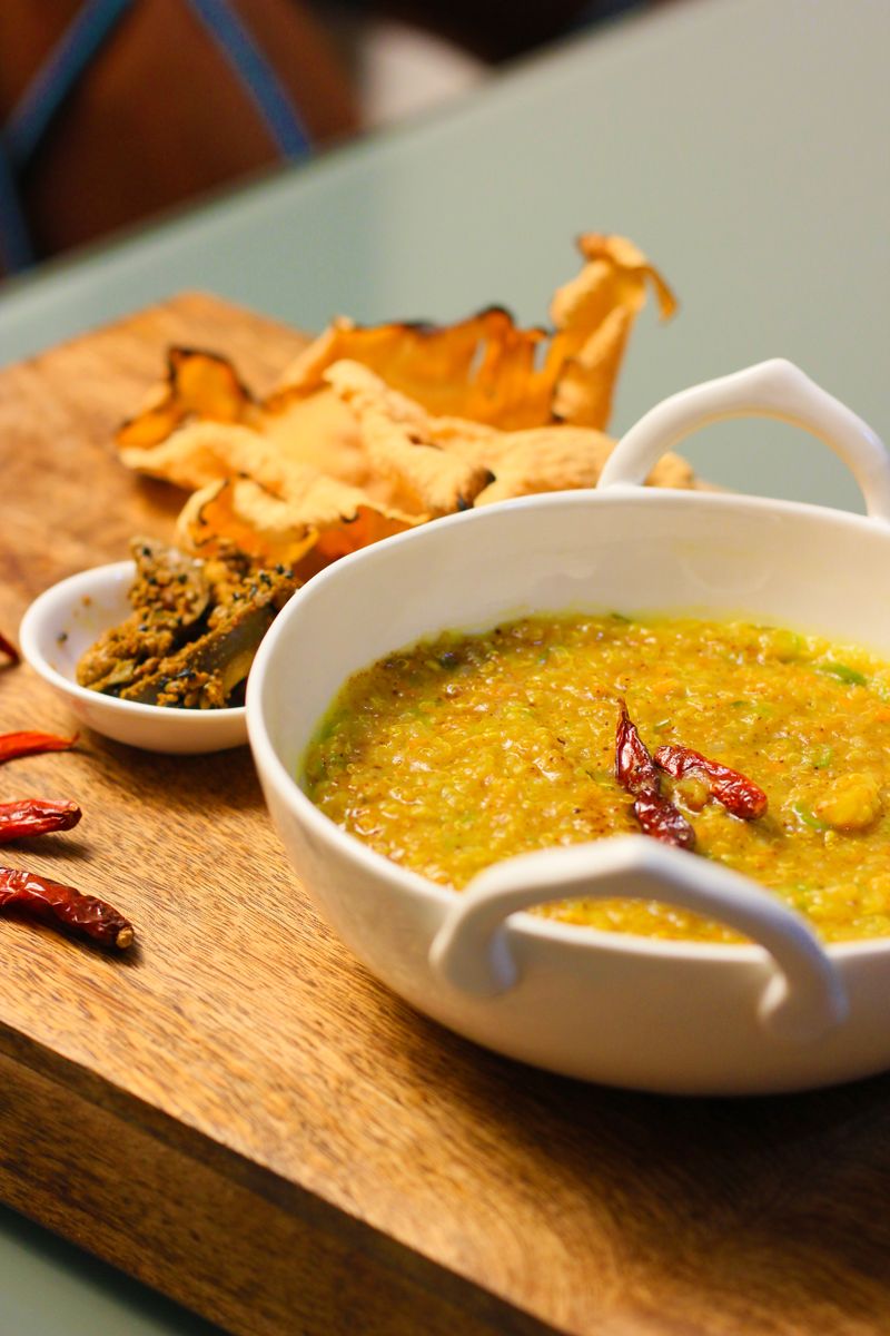Khichdi served with crispy chillies and papadum