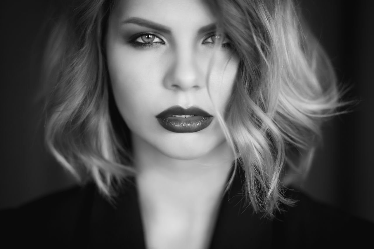 stunning black and white portrait of a woman with short hair and bold