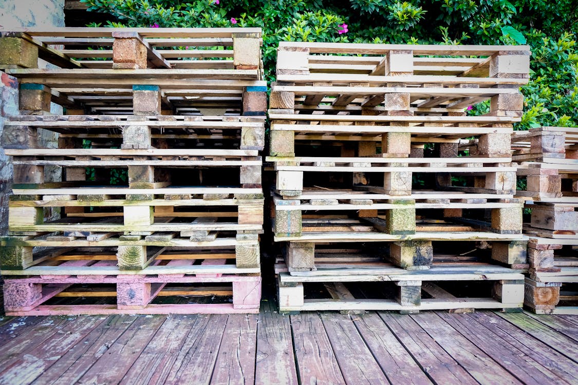 Stacks of used wooden pallets