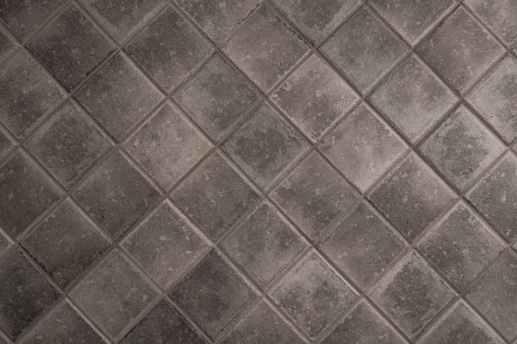 A Gray Tiled Surface With Diamond Shape Pattern