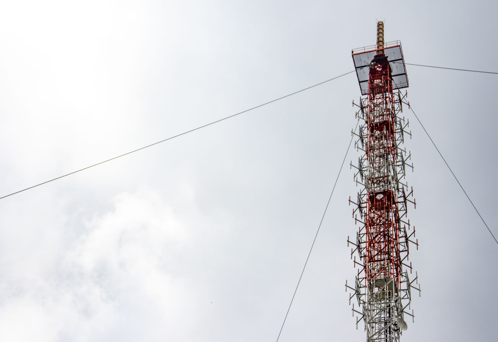 A Satellite Tower under a Cloudy Sky