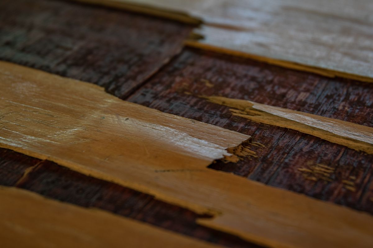 Detailed image showcasing rustic wooden floorboards with a worn, aged look.