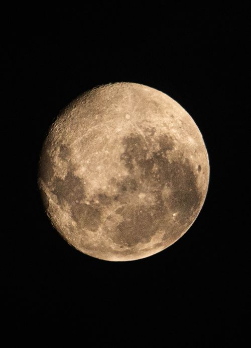 Free High-resolution image of the full moon against a dark night sky. Stock Photo