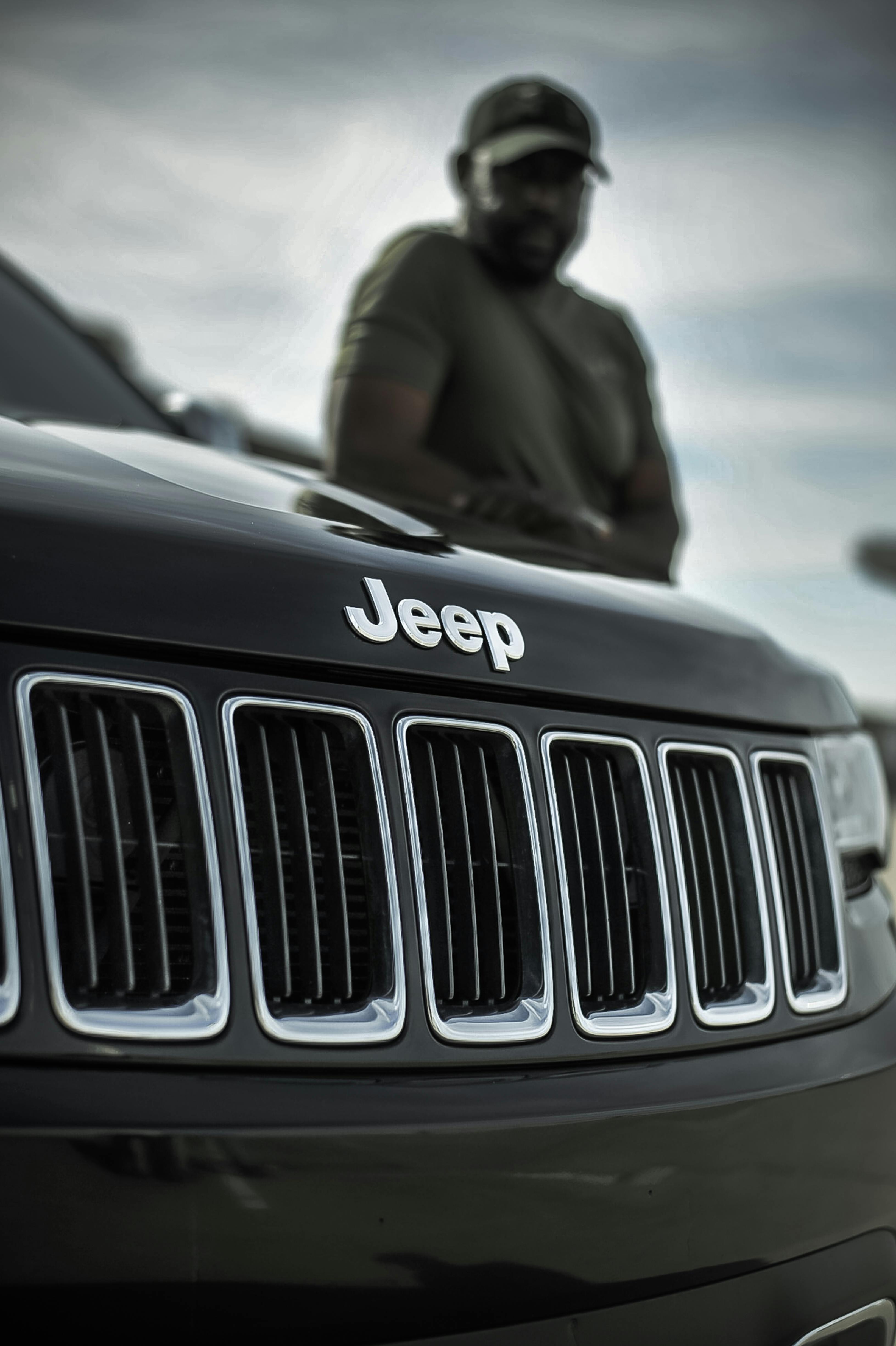 a grayscale photo of a jeep