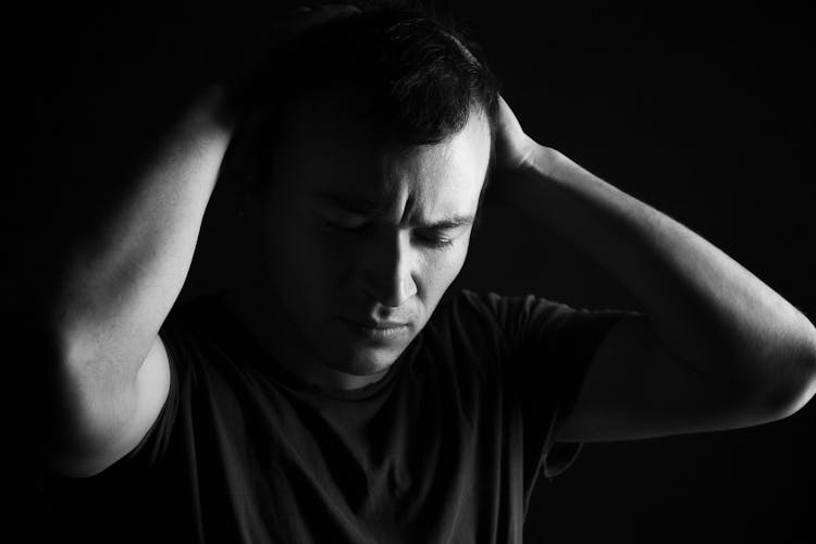 Grayscale Photo Of A Distressed Man 