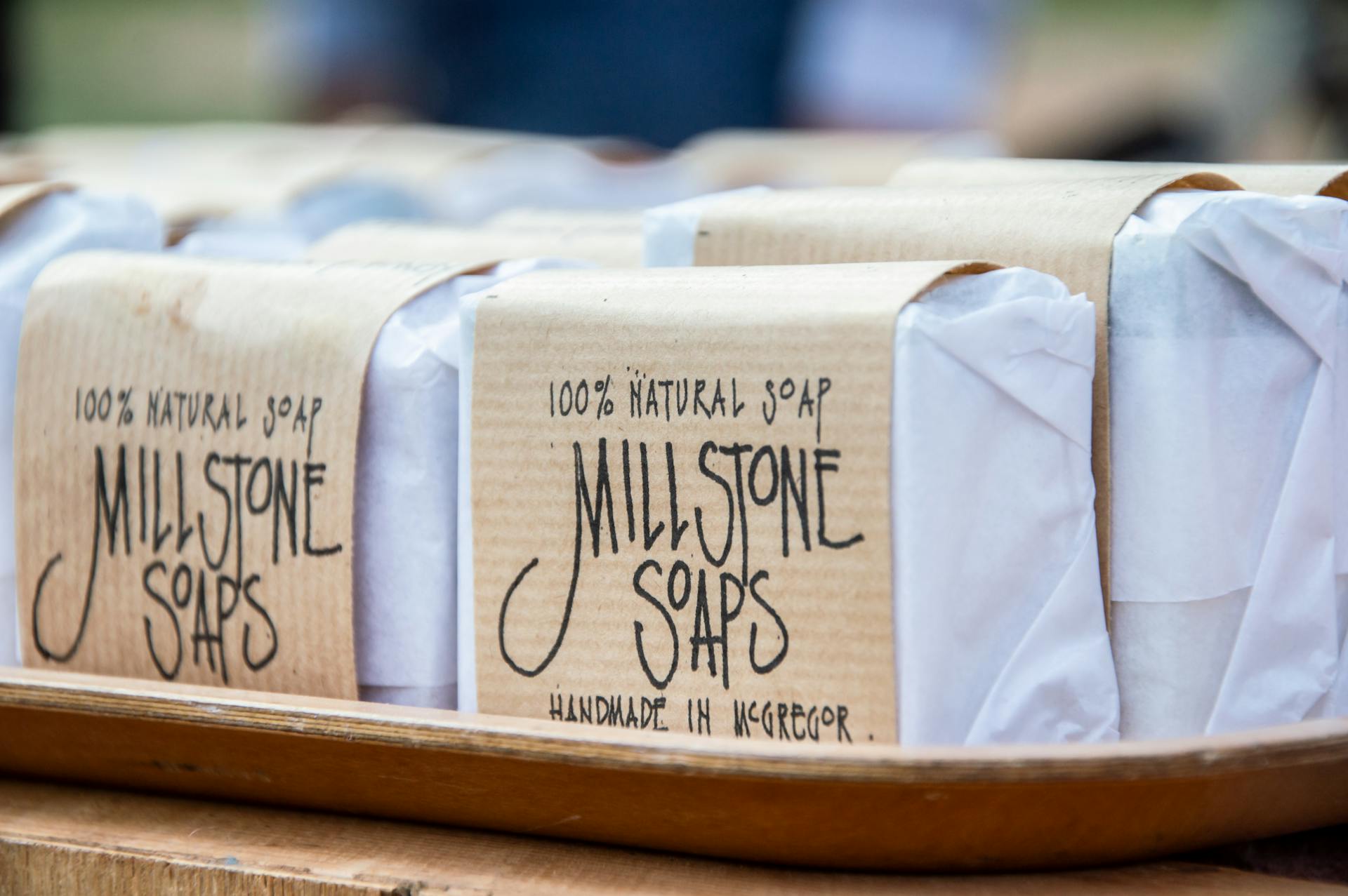 Close-up of handmade Millstone Soaps packaging showcasing natural and organic design.