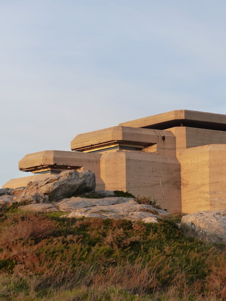 Facade Of Old Museum Located On Hill Under Blue Sky At Sunset