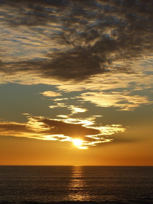 Amazing sunset sky over waving sea