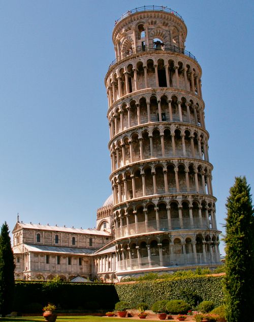 Free Capture of the Leaning Tower of Pisa under a clear blue sky in Italy. Stock Photo