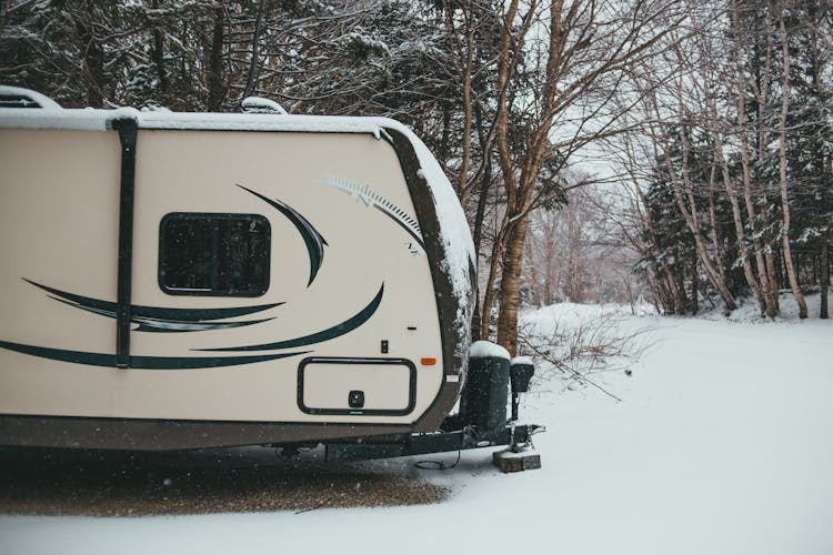 Travel Trailer In Snowy Woods