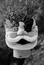 White Bird Ceramic Figurine in Grayscale Photography
