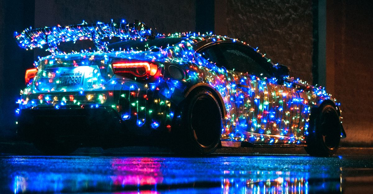 Led Wrapped Car Colorful Lights Wrapped Around a Coupe Car · Free Stock Photo
