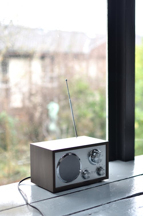 Modern portable radio set on windowsill