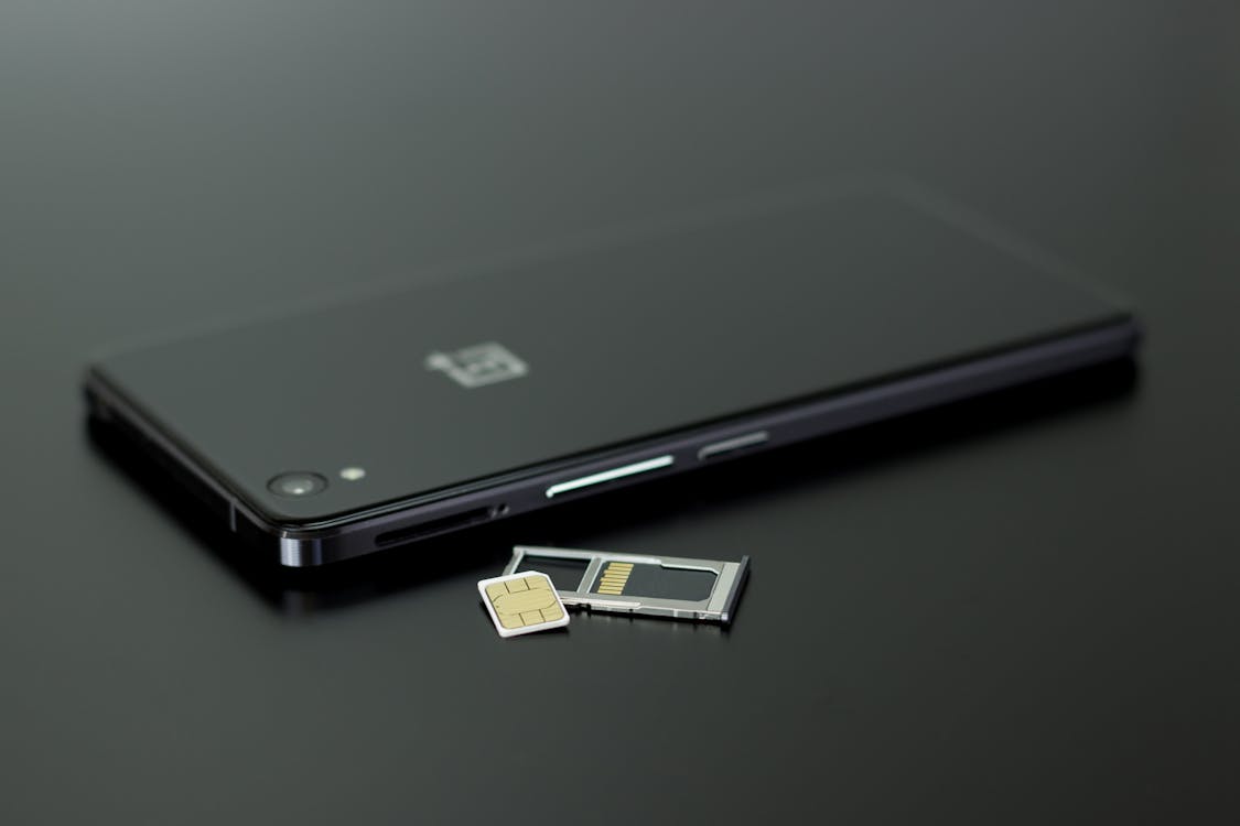 Black Smartphone on Black Table Top