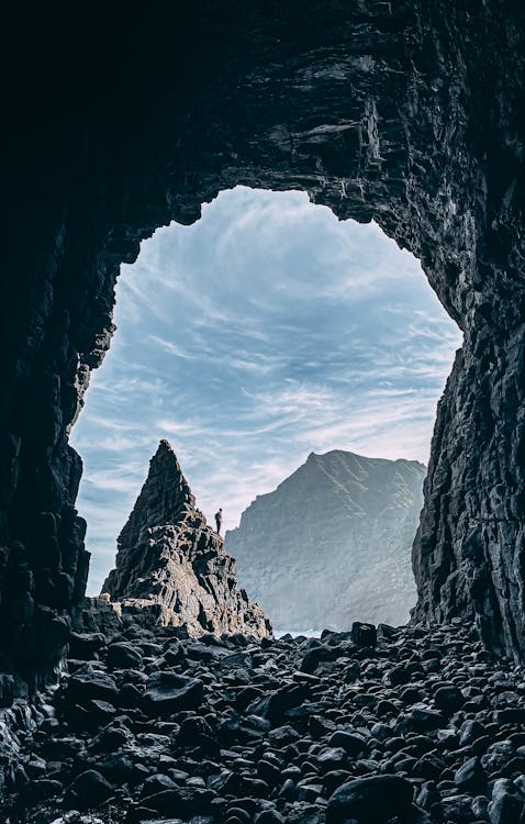 Free Rough rocky formation under cloudy sky Stock Photo