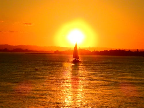 Free stock photo of boat, golden sunset, sailing ship Stock Photo