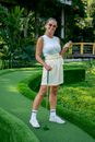 A Woman Holding a Golf Ball