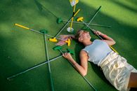 A Woman Lying on the Golf Course