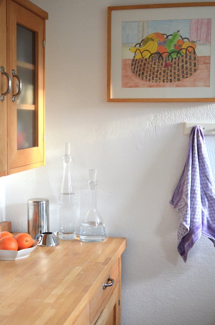 Kitchen Cupboard And Counter With Various Dishware