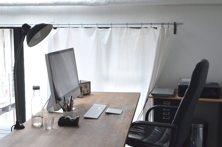 Workspace With Computer And Lamp Composed With Radio And Stationery