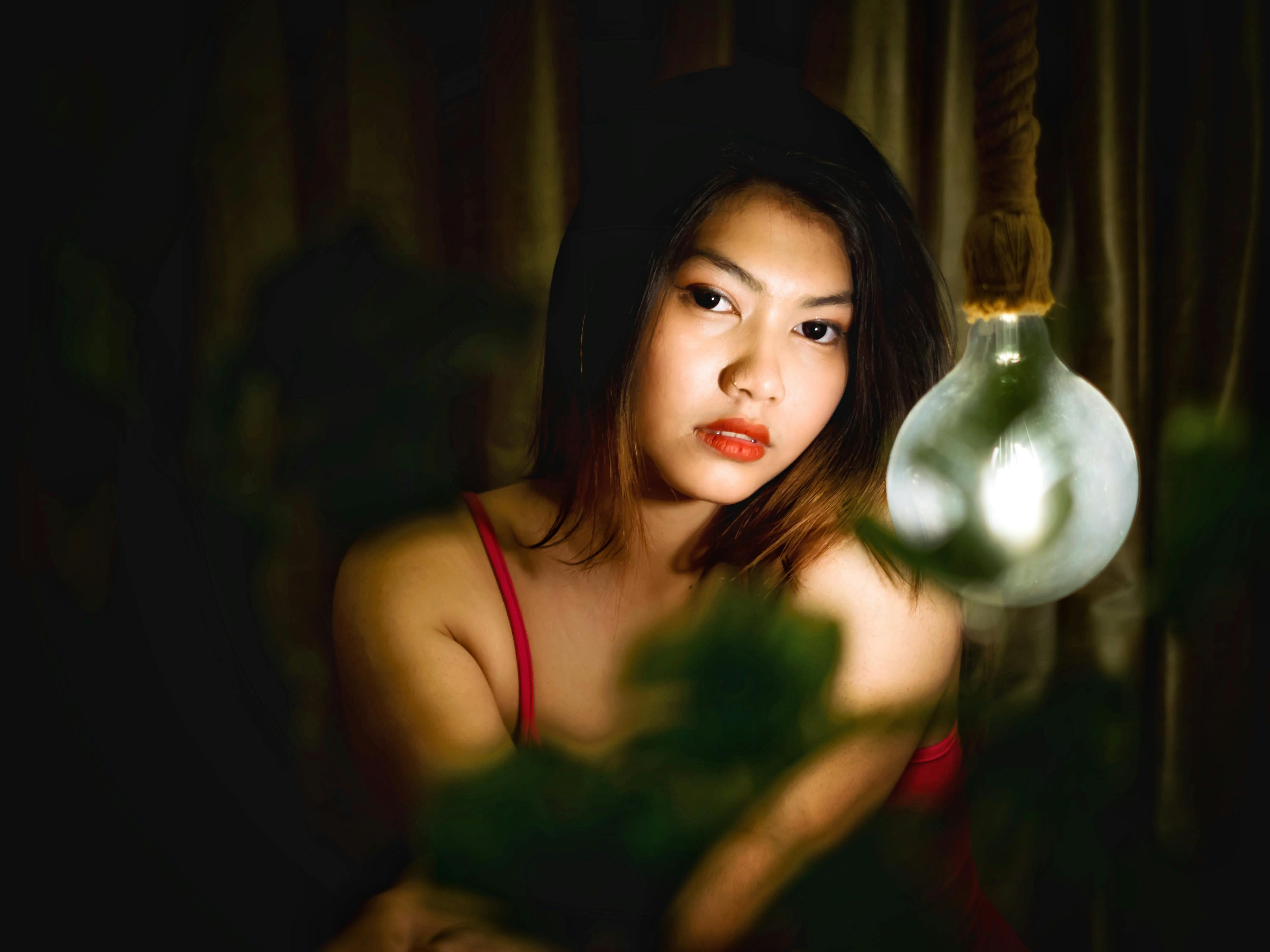 A Woman Looking at Herself in the Mirror · Free Stock Photo