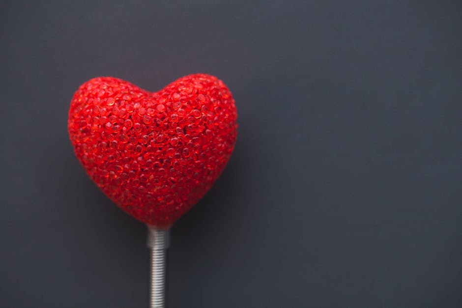 Big red heart on dark background