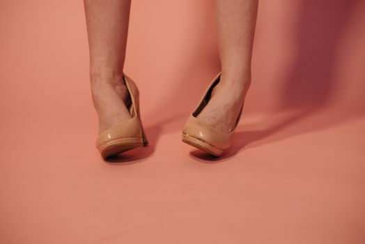 A Woman Wearing Brown High Heels Twisting her Ankles
