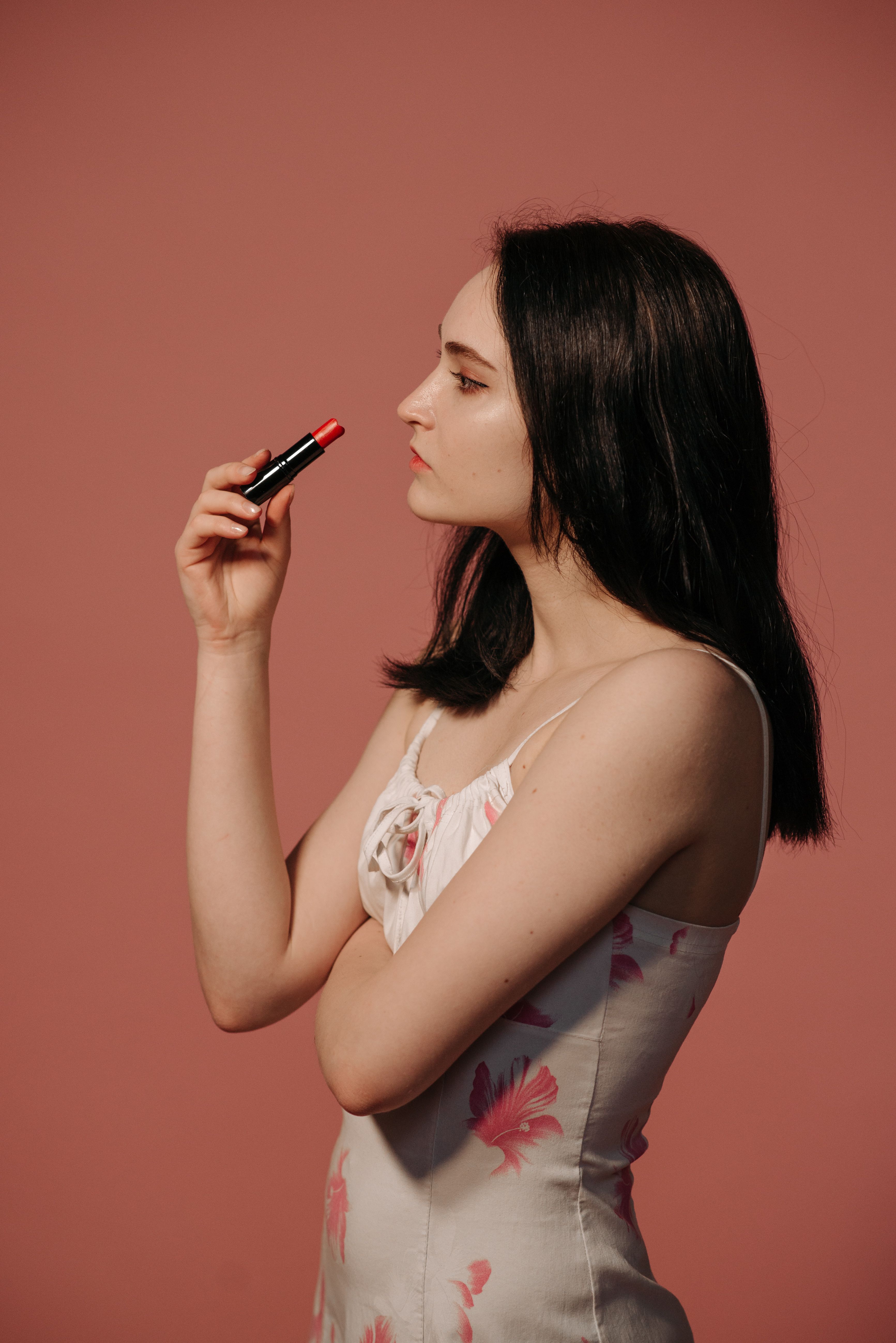 A Woman in White and Pink Floral Top Posing · Free Stock Photo