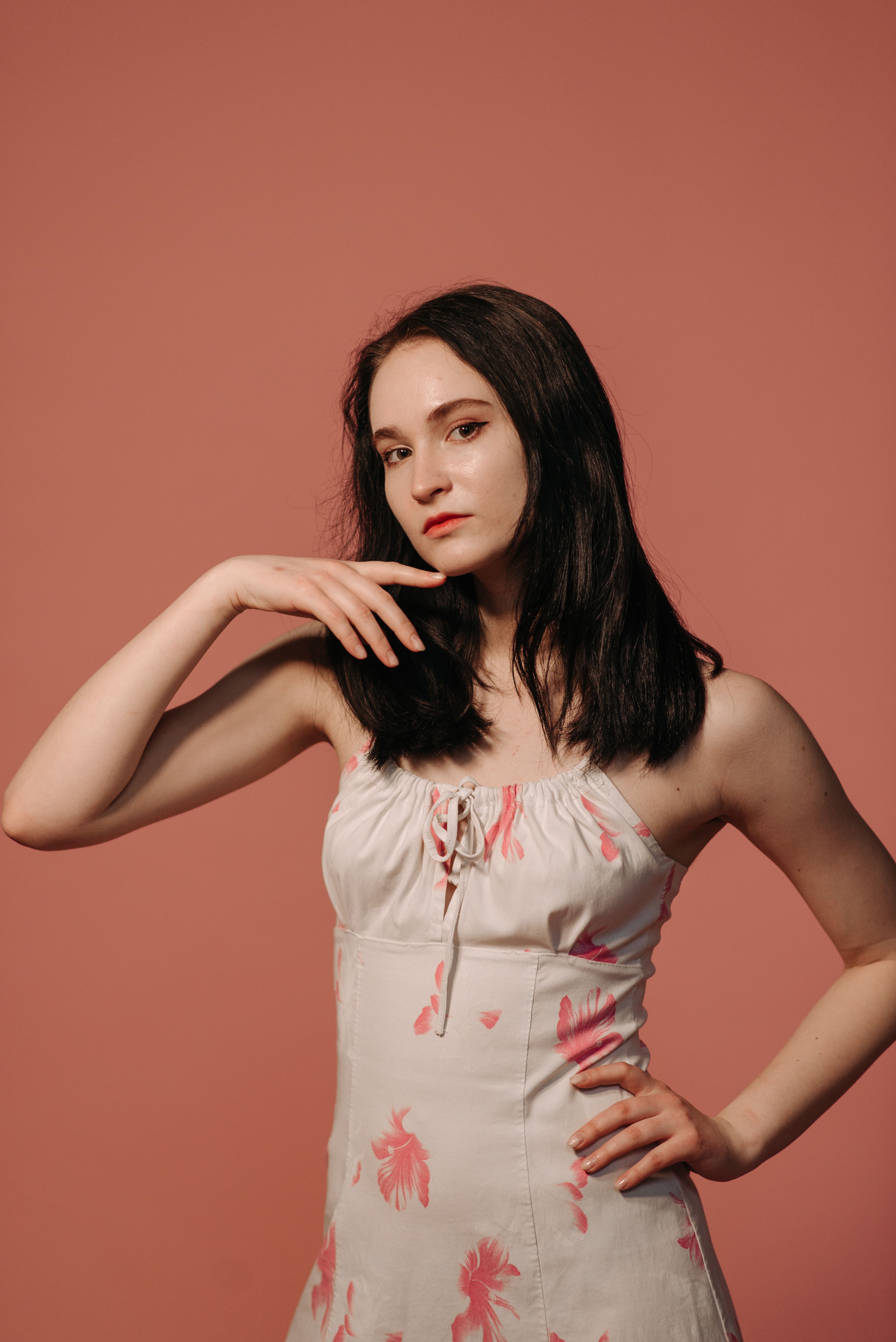 A Woman in White and Pink Floral Top Posing · Free Stock Photo