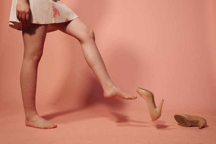 A Woman Removing Her Shoes