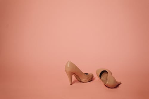 A Pair of Beige High Heel Shoes with Stain