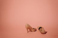 A Pair of Beige High Heel Shoes with Stain