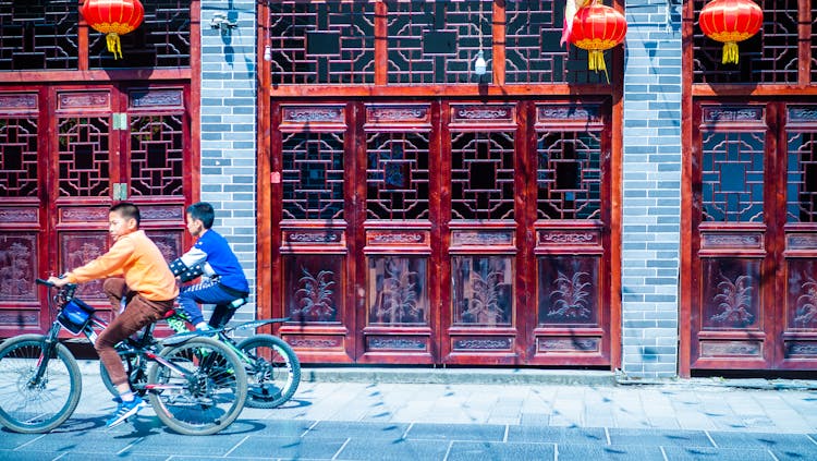 Young Boys Riding Their Bicycles