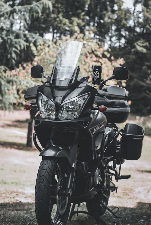 Free Black Motorcycle Parked on Brown Dirt Stock Photo
