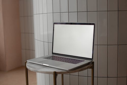 Open Laptop Lying on a Stool