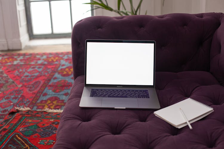 Laptop With Mockup Screen On Couch In Home Interior