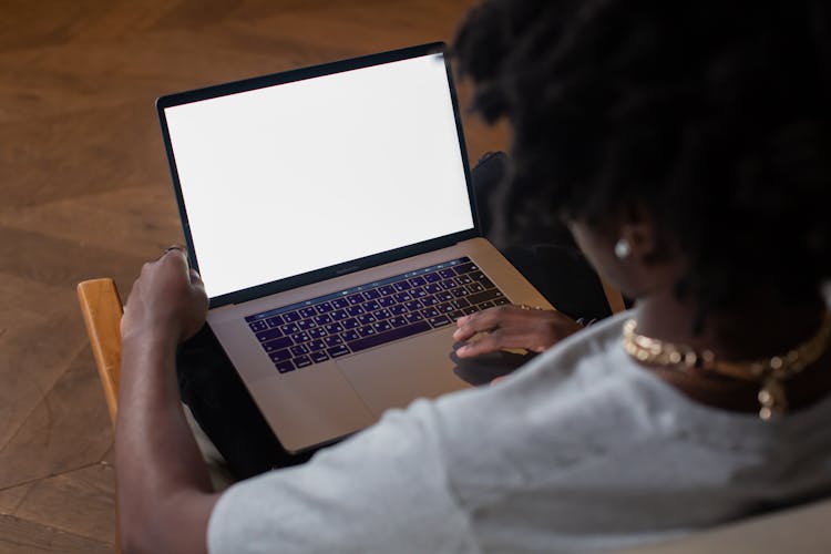 A Person Using A Laptop